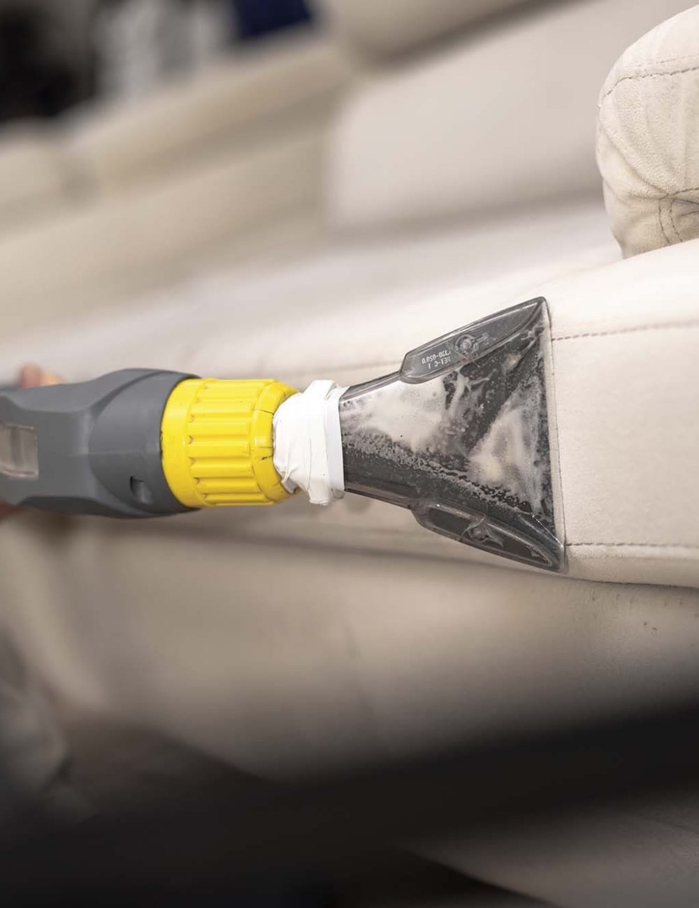 cleaning-dirty-sofa-with-sofa-washer-close-up-hands-holding-sofa-cleaner-professional-sofa-wash-sofa-wash-image (1)