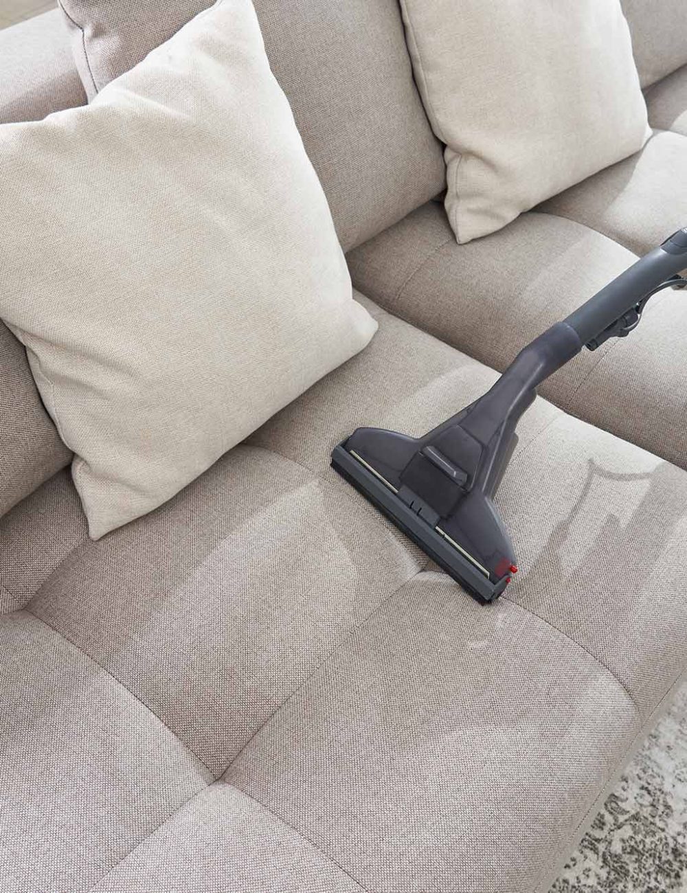 vacuum-cleaner-sofa-empty-living-room-modern-apartment